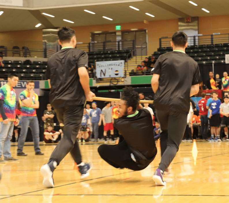 Earl Annogiyuk carried by Ed Kokeok and Derek Seppilu Jr.