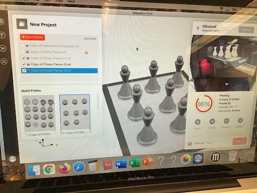 Computer screen showing chess pieces being designed in Tinkercad.