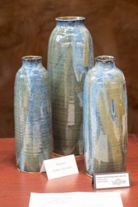 Three large ceramic vases in green and blue.